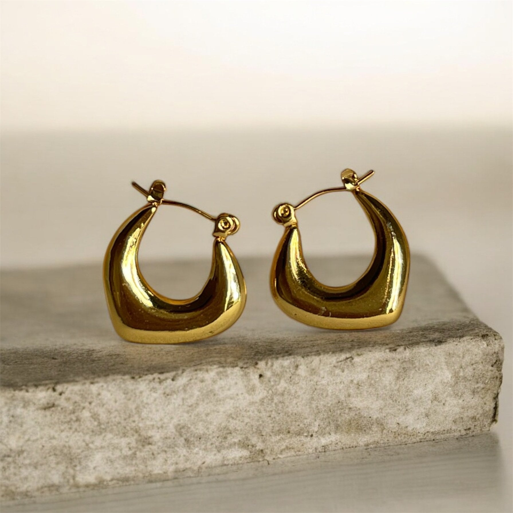 Boucles d'oreilles Détermination